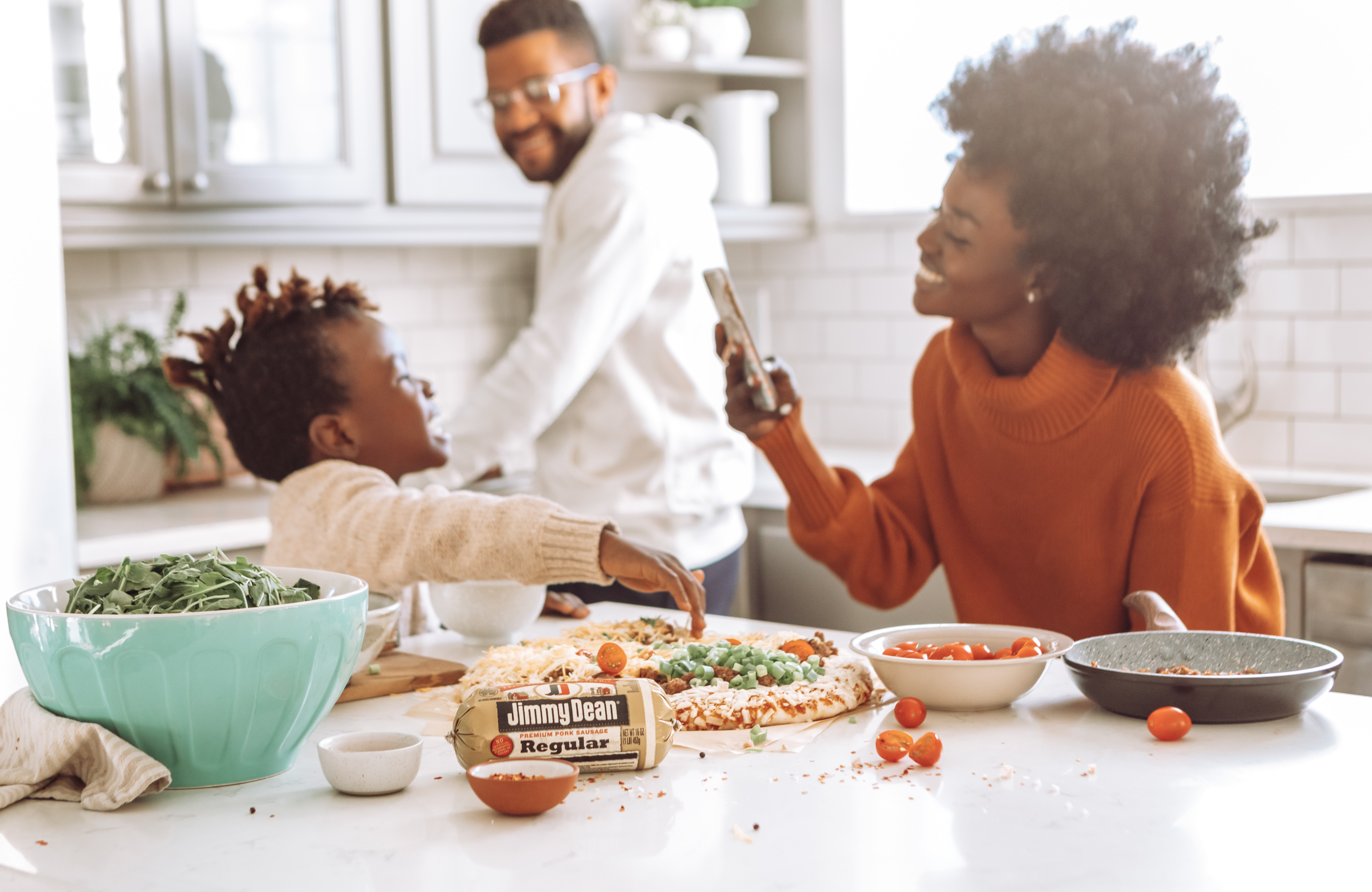 family-making-meal-together-in-kitchen